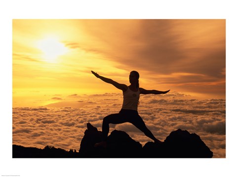 Framed Yellow silhouette of a young woman doing yoga, Hawaii, USA Print