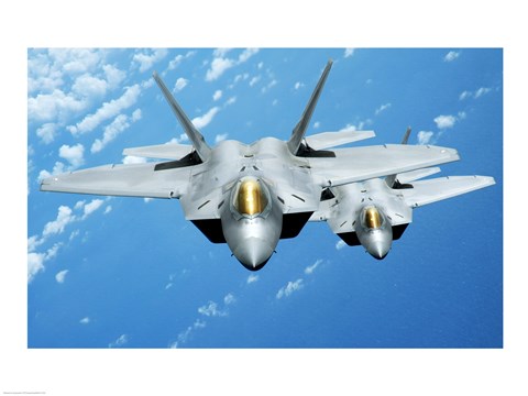Framed Two F-22 Raptors fly over during a theater security mission, Pacific Ocean Print