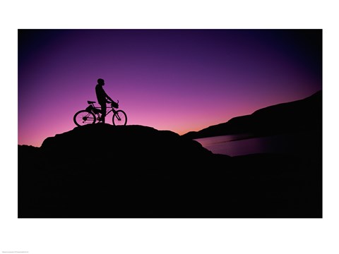 Framed Silhouette of a man standing with his mountain bike, Lake Powell, Utah, USA Print