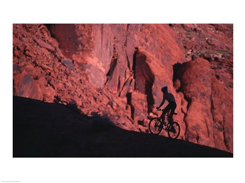 Framed Silhouette of a man mountain biking, Moab, Utah, USA Print