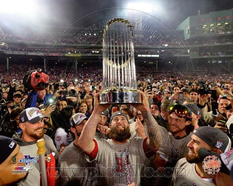 Framed Mike Napoli holds the World Series Trophy Game 6 of the 2013 World Series Print