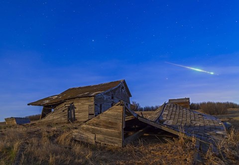 Framed bright bolide meteor breaking up as it enters the atmosphere Print