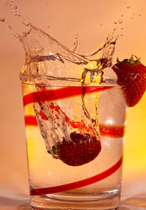 Framed Strawberry Splash In Red Swirl Glass I Print