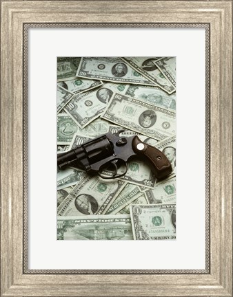 Framed Close-up of a handgun with paper currency Print