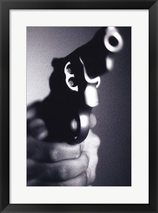 Framed Close-up of a person holding a handgun Print