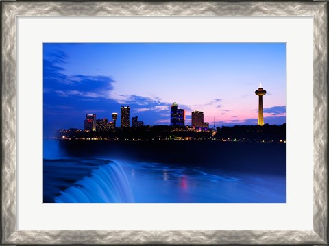Framed Waterfall with buildings lit up at dusk, American Falls, Niagara Falls, City of Niagara Falls, New York State, USA Print