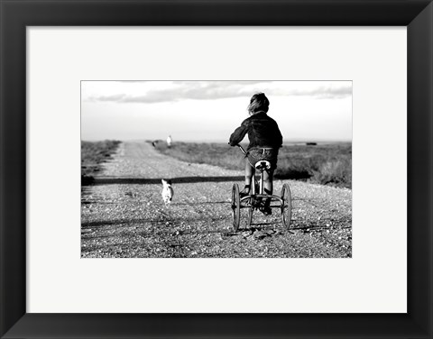 Framed Rear view of a girl riding a bicycle Print
