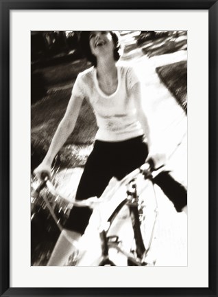 Framed Young woman riding a bicycle - black &amp; white Print