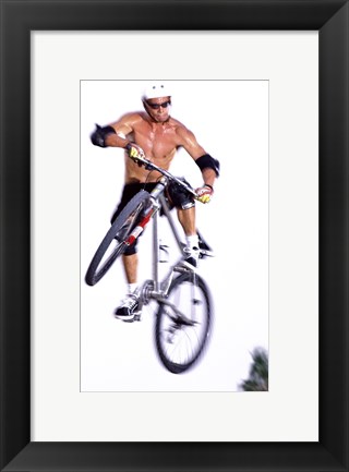 Framed Young man on a bicycle in mid-air Print
