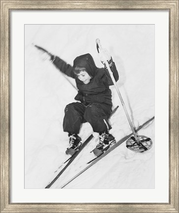Framed Boy skiing on snow Print