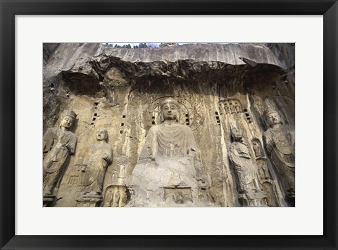 Framed Buddha Statue Carved on a wall, Longmen Caves,  ground view in China Print