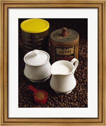 Framed Close-up of a mug of milk with a measuring spoon and jars on coffee beans Print