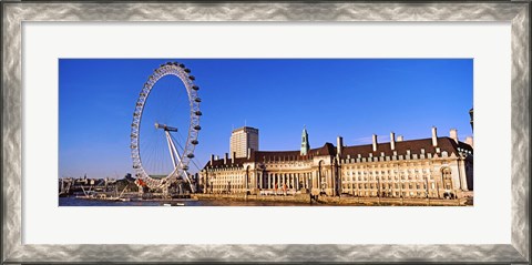 Framed Ferris wheel with buildings at the waterfront, River Thames, Millennium Wheel, London County Hall, London, England Print
