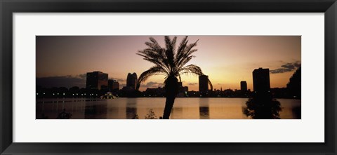 Framed Silhouette of buildings at the waterfront, Lake Eola, Summerlin Park, Orlando, Orange County, Florida, USA Print