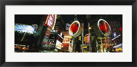 Framed Low angle view of buildings lit up at night, Times Square, Manhattan, New York City, New York State, USA Print