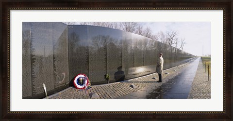 Framed Side profile of a person standing in front of a war memorial, Vietnam Veterans Memorial, Washington DC, USA Print