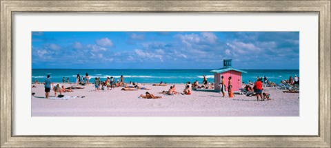 Framed Tourist on the beach, Miami, Florida, USA Print