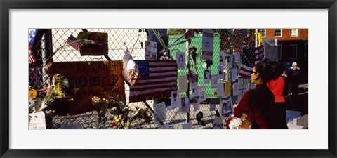 Framed Side profile of a woman standing in front of chain-link fence at a memorial, New York City, New York State, USA Print
