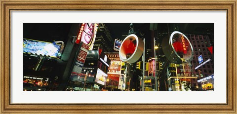 Framed Low angle view of buildings lit up at night, Times Square, Manhattan, New York City, New York State, USA Print