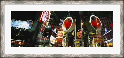 Framed Low angle view of buildings lit up at night, Times Square, Manhattan, New York City, New York State, USA Print