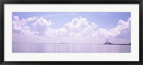 Framed Sea with a container ship and a suspension bridge in distant, Sunshine Skyway Bridge, Tampa Bay, Gulf of Mexico, Florida, USA Print