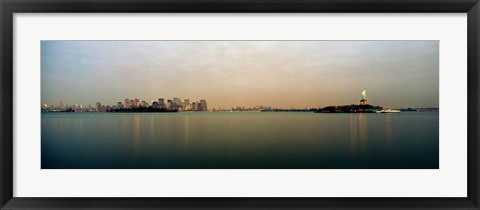 Framed River with the city skyline and Statue of Liberty in the background, New York Harbor, New York City, New York State, USA Print