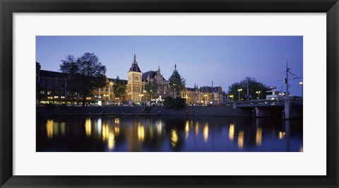 Framed Reflection of a railway station in water, Amsterdam Central Station, Amsterdam, Netherlands Print