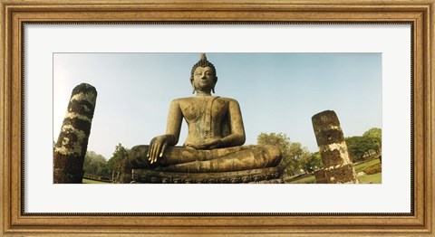 Framed Low angle view of a statue of Buddha, Sukhothai Historical Park, Sukhothai, Thailand Print