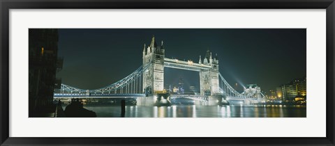 Framed Low angle view of a bridge lit up at night, Tower Bridge, London, England Print