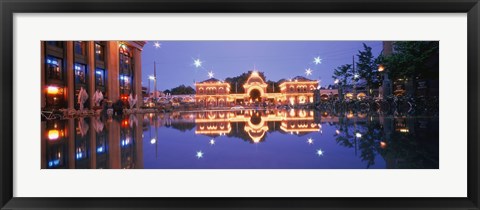 Framed Buildings in an amusement park lit up at dusk, Tivoli Gardens, Copenhagen, Denmark Print