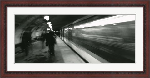 Framed Subway train passing through a subway station, London, England Print