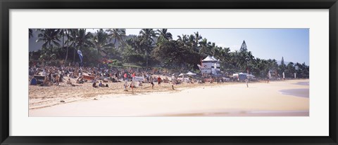 Framed Tourists on the beach, North Shore, Oahu, Hawaii, USA Print