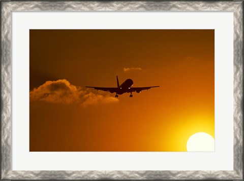 Framed Silhouette of airliner in golden sunset Print