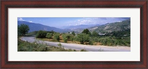 Framed Road passing through a landscape with mountains in the background, Andalucian Sierra Nevada, Andalusia, Spain Print