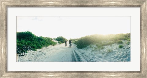 Framed Rear view of a couple cycling along a beach trail, Fort Tilden, Queens, New York City, New York State, USA Print