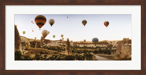 Framed Hot air balloons over landscape at sunrise, Cappadocia, Central Anatolia Region, Turkey Print