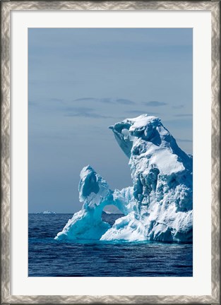 Framed arched iceberg floating in Gerlache Strait, Antarctica. Print