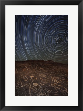 Framed Star trails at an ancient petroglyph site near Bishop, California Print