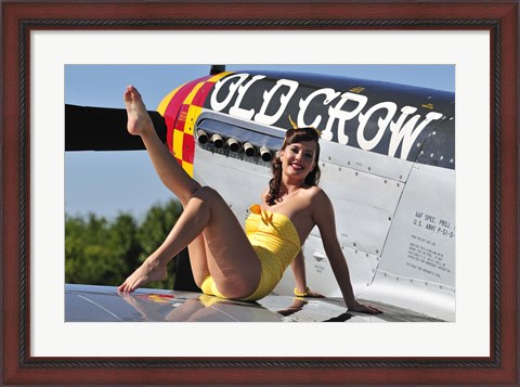 Framed Cute pin-up girl sitting on the wing of a P-51 Mustang Print