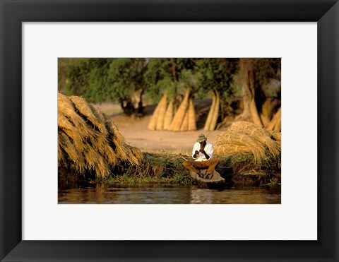 Framed Local Man Fishing and Piles of Straw for Hatch, Okavango Delta, Botswana Print