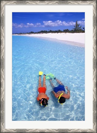 Framed Snorkeling in the blue waters of the Bahamas Print