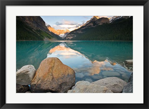 Framed Rocky Mountains and boulders reflected in Lake Louise, Banff National Park, Alberta, Canada Print