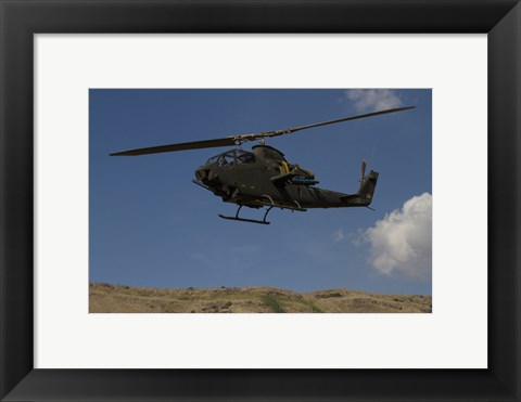 Framed AH-1F Tzefa of the Israeli Air Force flying over the Golan Heights, Israel Print