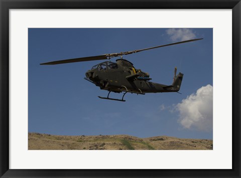 Framed AH-1F Tzefa of the Israeli Air Force flying over the Golan Heights, Israel Print