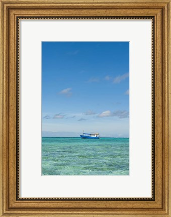 Framed Fishing boat in the turquoise waters of the blue lagoon, Fiji Print