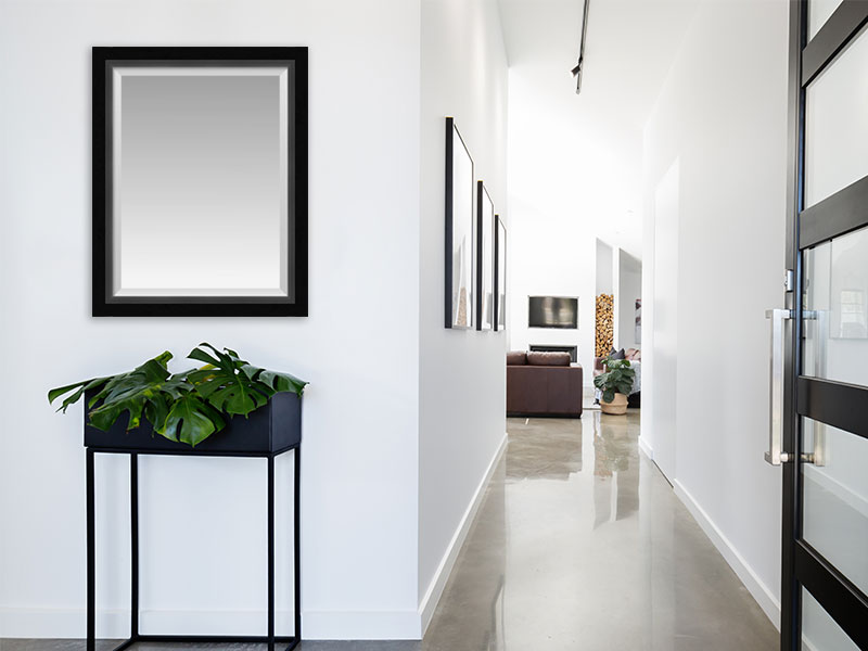 framed mirror in hallway