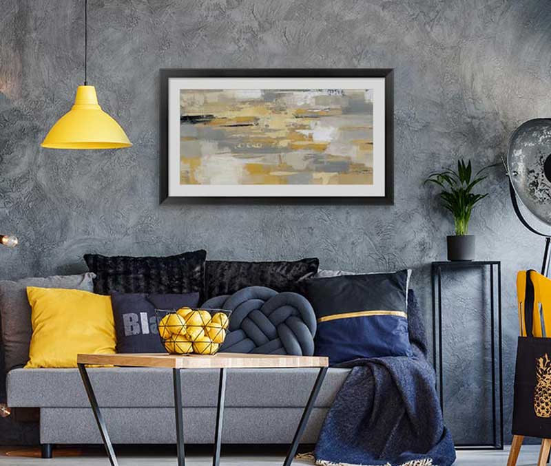 Framed Illuminating Yellow art in a gray room