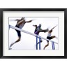 Low angle view of three men jumping over a hurdle (R694439-AEAEAGOFLM)