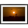 Terry Moore/Stocktrek Images - UH-60 Blackhawk Flies Over Camp Speicher Airfield at Sunset (R803993-AEAEAGOFDM)