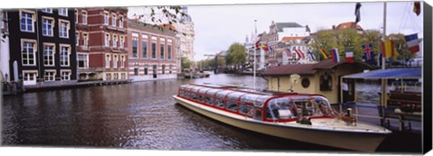 Framed Tourboat in a channel, Amsterdam, Netherlands Print